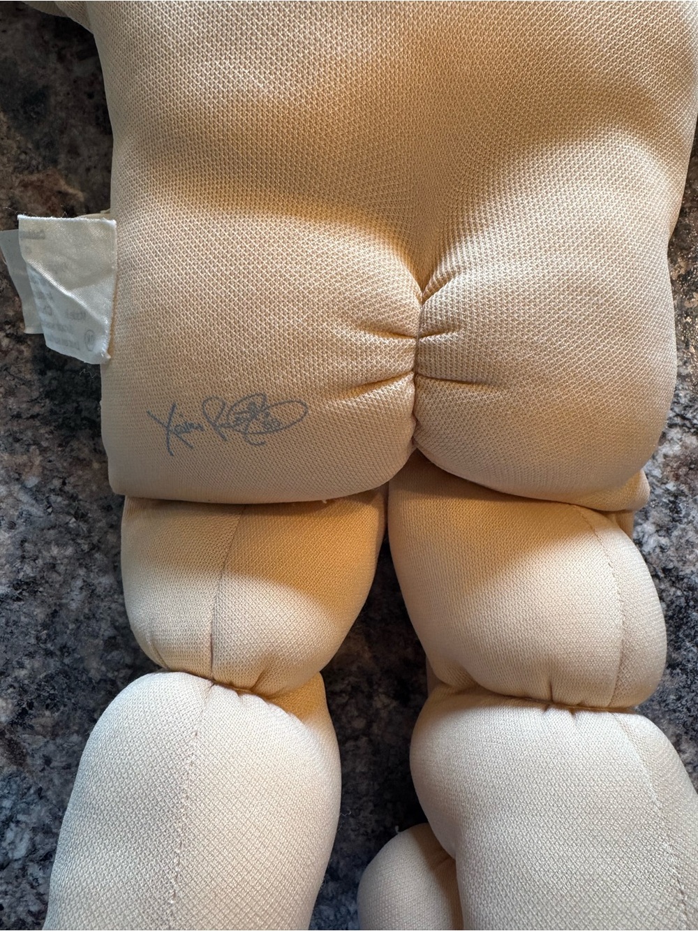 A Cabbage Patch Kid doll with blonde yarn hair and a purple dress - Picture 8 of 11